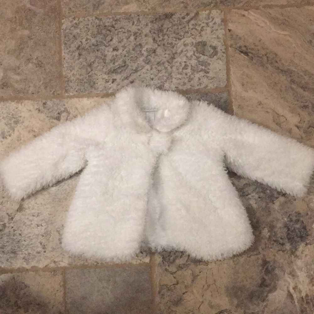 First Impressions white faux fur coat